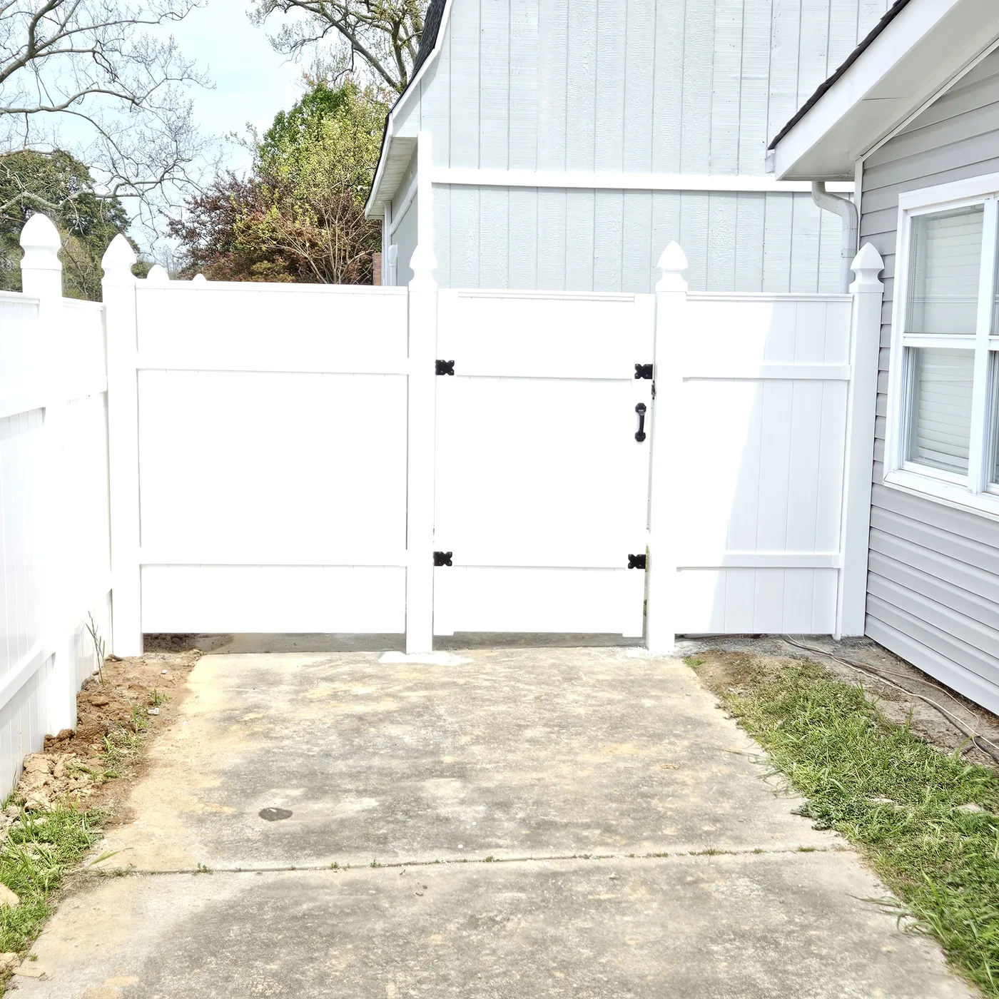 White vinyl privacy walk gate with gothic post caps