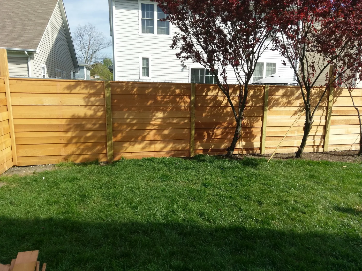 Horizontal cedar board-on-board privacy fence built by VB Fences