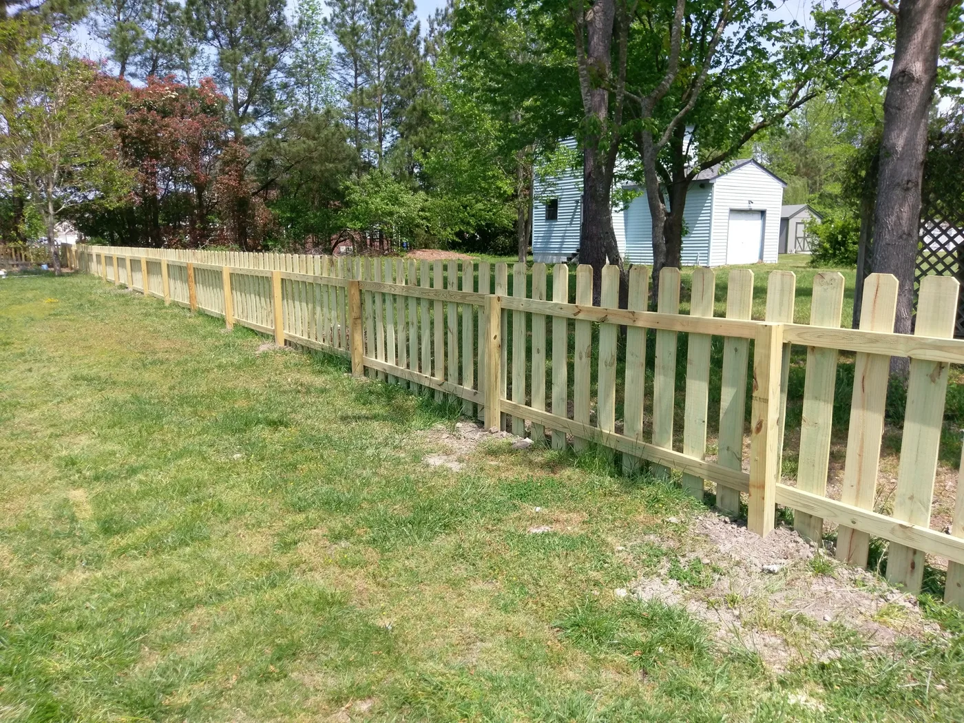 Traditional spaced picket fence, open sight lines with a defined boundary